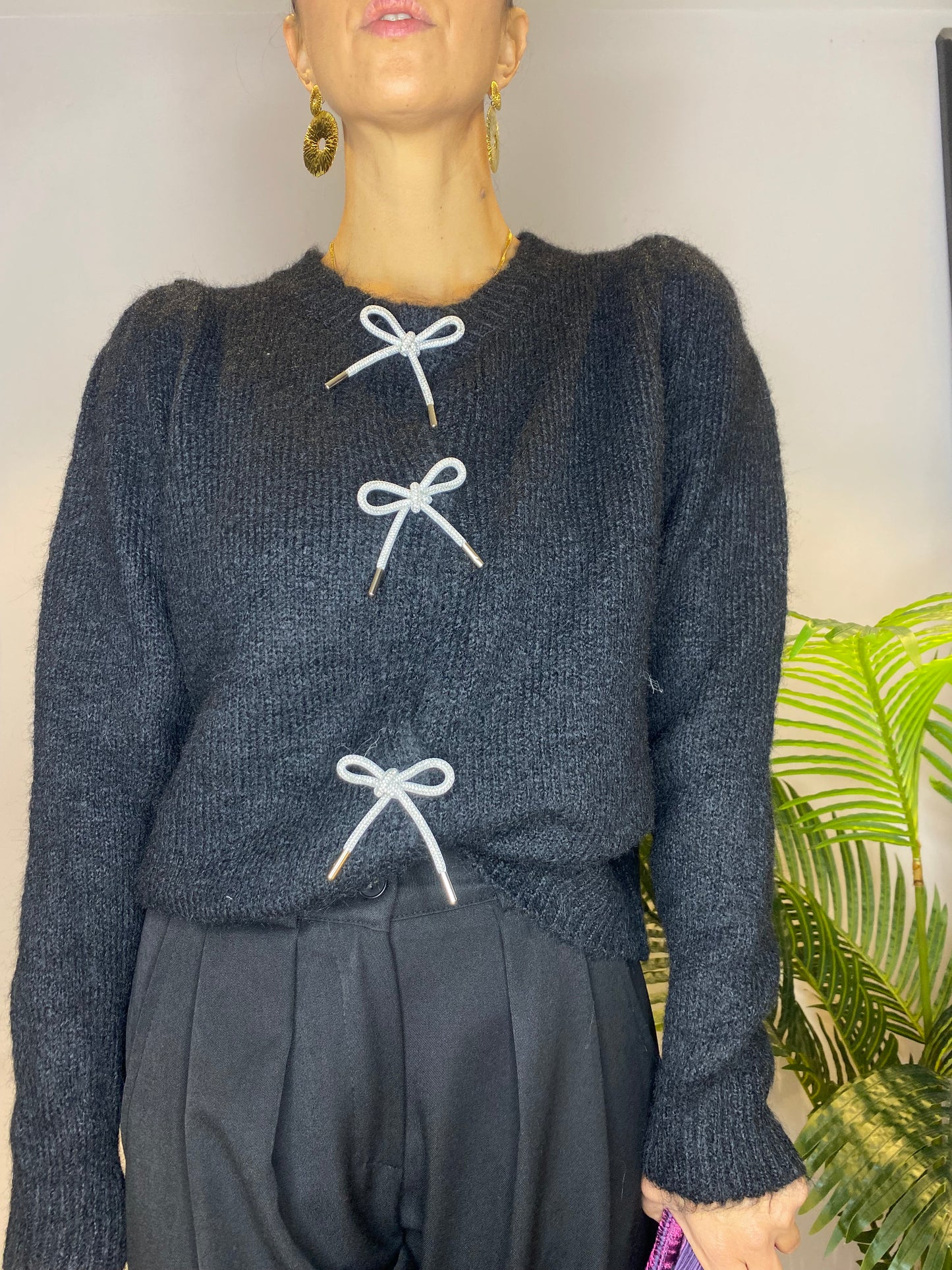 Cardigan con fiocchi argentati